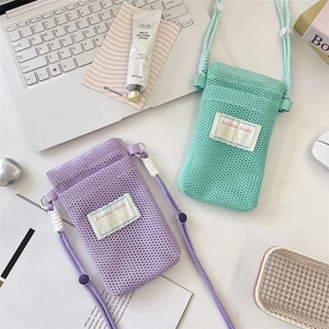 Close-up of mesh phone pouches in purple and mint green with adjustable thick lanyards