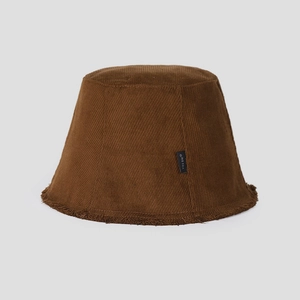 Close-up of brown corduroy bucket hat with frayed brim and branded woven label