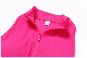 Detail of rose red athletic bodysuit featuring high neck zipper and textured fabric
