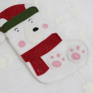 Handmade white polar bear felt Christmas stocking with red scarf and green hat for decor