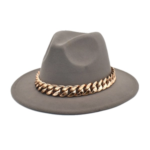 Close-up of grey wool fedora hat featuring a chunky gold metal chain embellishment