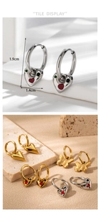 Detailed view of heart and butterfly earrings with size labels and vibrant enamel inlay