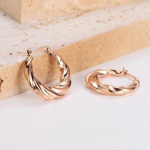 Fashionable rose gold twisted hoop earrings with a textured spiral design for women