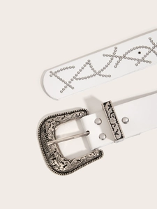 Close-up of white punk belt featuring silver carved buckle and stylish rivet detailing