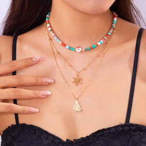 Three-layer Christmas choker with red green beads, Santa charm and gold snowflake pendants