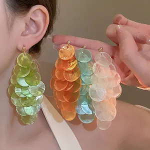 Elegant multi-layer shell tassel earrings with translucent discs in green, orange and blue