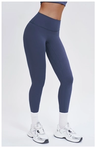 Detail of high-waist navy yoga pants with flexible fabric and sleek seamless design