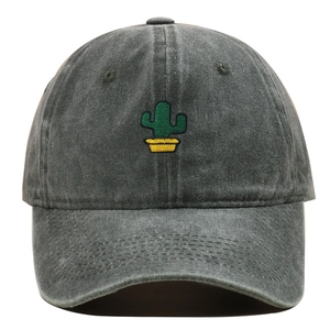 Close-up of green cactus embroidery on dark grey washed cotton baseball cap