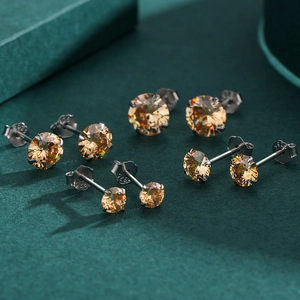 Set of four 925 sterling silver amber cubic zirconia stud earrings in classic 4-prong setting