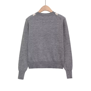 Gray long sleeve knit sweater with retro argyle patterns and ribbed cuffs, back view