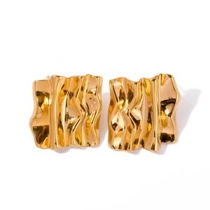 Vintage golden rectangular stud earrings with irregular ripple texture on white background