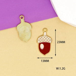 Macro view of gold-plated enamel acorn charms with dimensions 23mm by 13mm for DIY jewelry