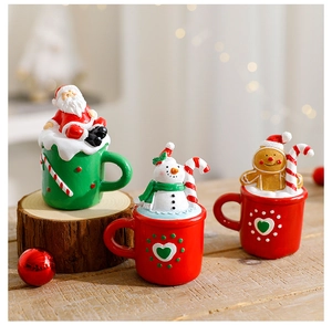 Miniature Christmas teacup ornaments featuring Santa, Snowman and Gingerbread Man