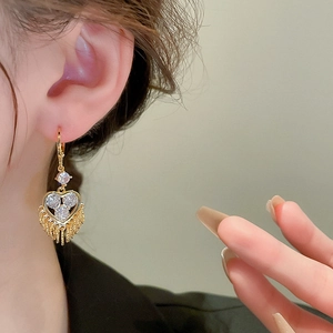 Elegant gold-plated heart fringe earrings featuring sparkling cubic zirconia stones
