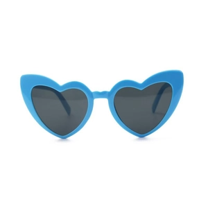 Detail of light blue heart-shaped sunglasses with dark tinted lenses and glossy frames