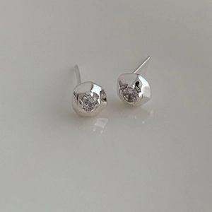 Minimalist 925 sterling silver stud earrings with organic texture and sparkling cubic zirconia