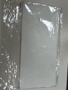 Close-up of 100pcs fragile item warning stickers packed in a clear OPP protective bag
