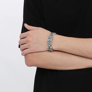 Detail of gothic floral relief on vintage silver finish stainless steel bracelet