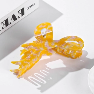 Large tortoiseshell marble pattern acetate hair claw clip for women on white background