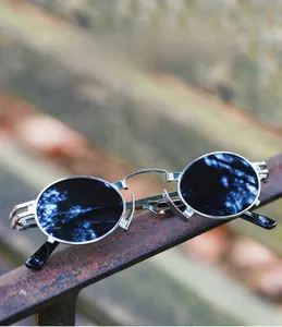 Steampunk oval sunglasses with silver metal gear frames on industrial rust beam