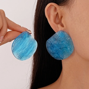 Chic blue transparent resin stud earrings with irregular geometric striped texture
