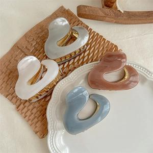 Set of four minimalist acetate hair claws in grey, white, brown and blue-grey finishes