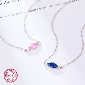 Sterling 925 silver necklace featuring marquise-cut pink and blue cubic zirconia pendants