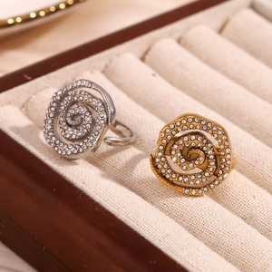 Minimalist spiral 18K gold and silver plated open rings with zircon inlay on beige velvet