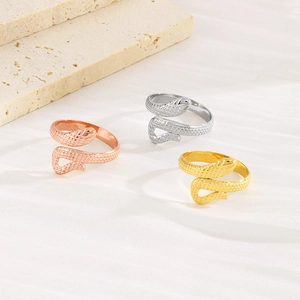 Detailed close-up of snake-shaped rings in gold, silver, and rose gold finishes