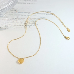 Polished K18 gold heart pendant necklace on minimalist link chain with lobster clasp