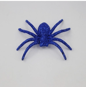 Detail view of a blue glitter spider decoration for Halloween party and haunted house props