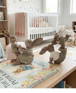Detail of vintage resin rabbit figurines showing exquisite fur texture and acrobatic poses