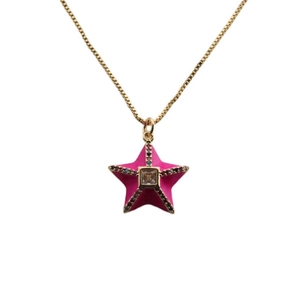 Detail of gold star necklace featuring pink pendant with center gem and colorful halo