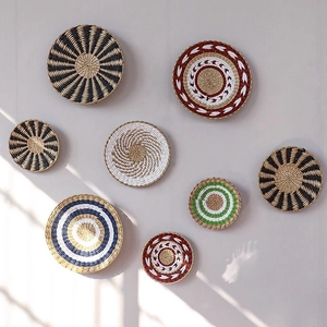 8-piece woven wall basket decor set with bohemian geometric patterns in natural fibers