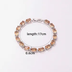 Close-up of amber cubic zirconia bracelet with silver-plated base and secure metal clasp