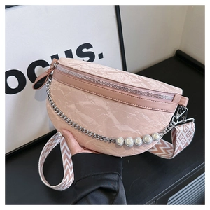 Pink crescent chest bag featuring marble-textured leather and elegant pearl chain detail