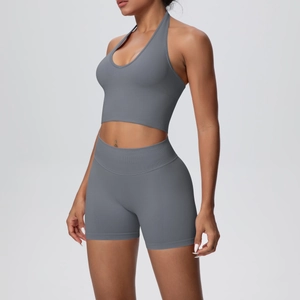 Close-up of dark grey halter sports bra and high waist shorts in ribbed knit fabric
