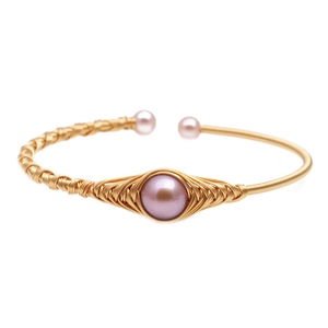 Minimalist woven gold wire bracelet featuring mixed natural freshwater pearls in pink and purple