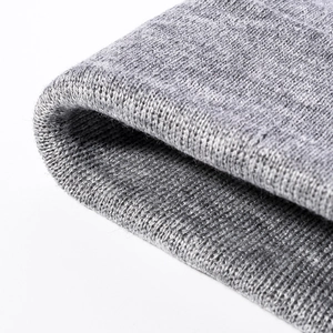 Winter knitted beanie hat with thick jacquard texture and warm folded cuff detail