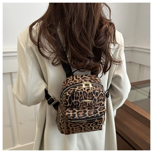 Trendy leopard print mini backpack for women with gold hardware and adjustable straps