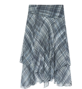 Detail of blue-gray plaid midi skirt with asymmetrical cut and layered draping fabric