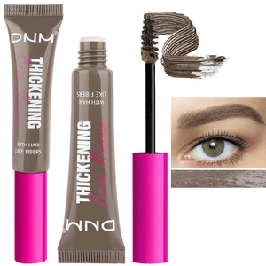 Detailed view of fiber-enriched brow mascara with spiral brush and texture swatches