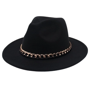 Detailed view of black wool fedora with a decorative chunky rose gold metal chain band