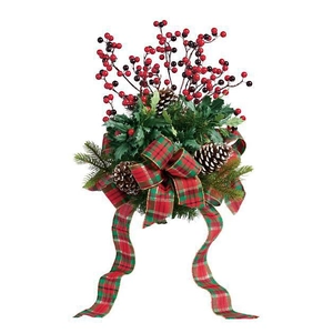 Christmas wreath with red berries pine cones and a green red plaid ribbon bow