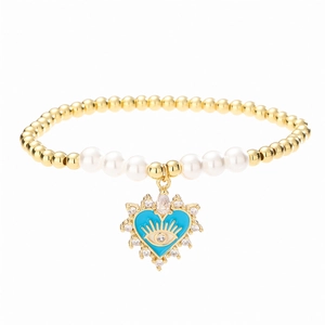 Gold beaded heart evil eye bracelet with white pearls and blue enamel charm