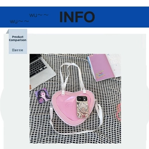Detailed top view of pink heart-shaped clear Ita bag with white adjustable strap on a rug