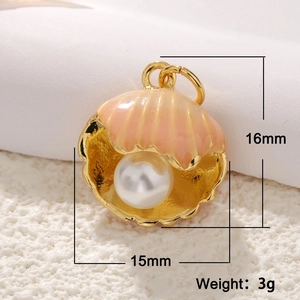 Detail view of 15x16mm gold shell pendant with white pearl on white plush surface