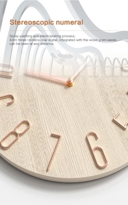 Detail of 4mm thick rose gold numbers and wood texture on a modern wall clock
