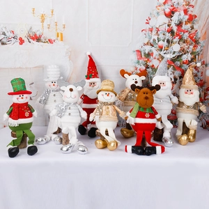 Plush Christmas dolls featuring Santa, reindeer, and snowman figurines in festive scene
