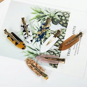 Set of 7 seamless cellulose acetate tortoiseshell hair clips with gold alloy ducksbill base